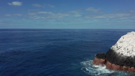 Backward-aerial-reveals-Roca-Partida-Split-Rock,-Revillagigedo-Islands,-Mexico