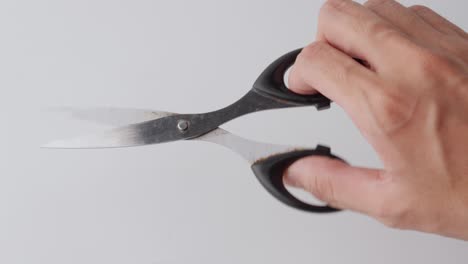 Scissors-being-tested-against-a-white-background