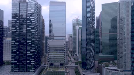 Fly-over-the-business-district-in-the-city-of-Singapore-during-the-day