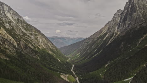 Rogers-Pass-BC-Canada-Aerial-v7-drone-flyover-the-Hermit-Trailhead-capturing-the-Trans-Canada-Highway-winding-through-the-wilderness-of-mountain-valleys---Shot-with-Mavic-3-Pro-Cine---July-2023