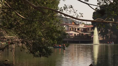 Small-lagoon-landscape-in-tourist-area-with-small-boats-sailing