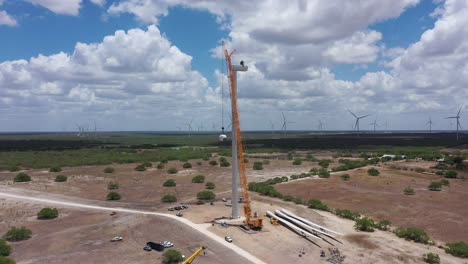 Renewable-energy-large-wind-turbine-construction-using-large-crane-lifting-a-wind-turbine-hub