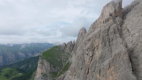 Cinematic-aerial-footage-of-a-drone-soaring-close-to-the-Selva-mountain-range-near-Passo-Gardena,-Dolomites