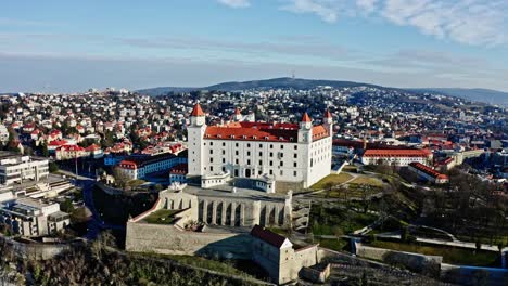 Beautiful-wide-panoramic-shot-of-Bratislava-castle---historical-landmark-of-Slovak-Republic,-National-Council-and-downtown-skyline-on-sunny-morning