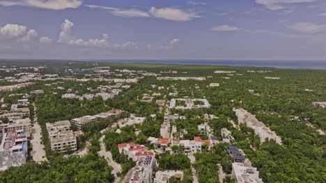 Tulum-Mexico-Aerial-v12-drone-flyover-luxury-residential-neighborhood-capturing-new-construction-properties-surrounded-by-lush-forest-and-ocean-landscape-views---Shot-with-Mavic-3-Pro-Cine---July-2023