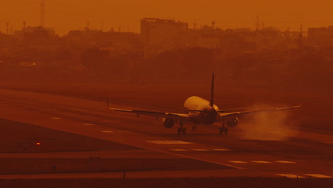 slow-motion-of-passenger-plane-lands-on-the-runway-at-the-airport