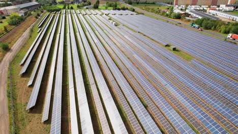 Aerial-view-of-solar-panel-rows-on-the-ground-in-Grossenhain,-Germany