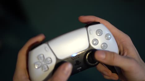 Close-Up-Of-A-Young-Man-Holding-A-Game-Controller-While-Playing-A-Video-Game