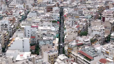 aerial-drone-footage-of-buildings-at-Athens-city-Greece,-urban-center-cinematography