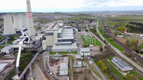 Chvaletice-Power-Station,-Chvaletice,-Czech-Republic---Coal-Power-Plant-with-Chimneys-and-Cooling-Towers---Drone-Flying-Forward