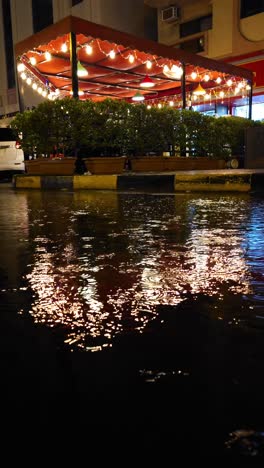 On-April-16,-2024,-traffic-navigated-through-a-flooded-road-in-Sharjah,-UAE,-after-record-breaking-rains-hit-the-country