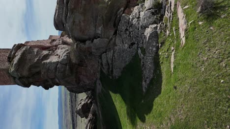 Aerial-drone-vertical-view-of-the-tower-of-a-castle-built-in-the-top-of-a-rocky-hill