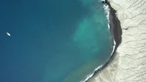 Abstract-top-down-drone-dolly-of-San-Benedicto-coastline,-Revillagigedo-Islands