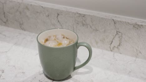 Close-up-spin-of-fresh-ice-coffee-in-mug