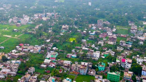 Outside-Dhaka-City-Suburbs-Urbanization,-Bangladesh,-Aerial-Descending-Shot