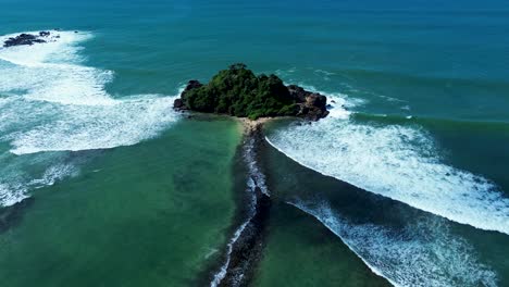 Aerial-drone-Devil-Rock-Midigama-surfing-Indian-Ocean-waves-sandy-beach-channel-inlet-clear-water-Sri-Lanka-tourism-travel-holidays-Asia
