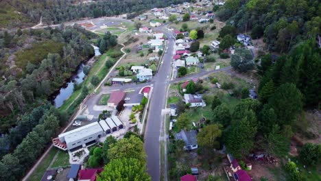 Derby,-Tasmania-aerial-tilt-down-over-small-regional-town,-Australia