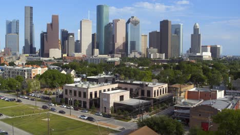 Ascending-Drone-shot-of-downtown-Houston,-Texas-and-surrounding-area