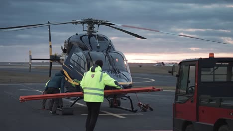 Piilot-along-with-airport-stuff-conducts-maintenance-of-the-Bell-429-helicopter-at-the-Vaclav-Havel-airport-in-Prague