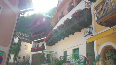 Sun-Flare-Shines-on-Wooden-Façade-House-in-Hallstatt-on-a-Sunny-Day