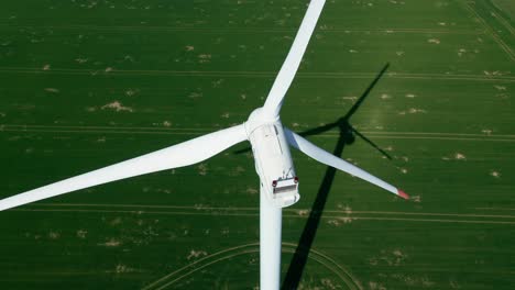 Aerial-above-white-wind-turbine,-generate-eco-friendly-electricity