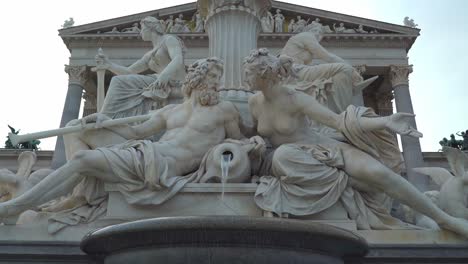 Statues-of-a-Man-and-Woman-Carved-into-Fountain-near-Austrian-Parliament