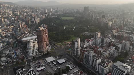 Aerial-drone-video-view-footage-of-Qutio-early-morning-sunrise-capital-city-of-Ecuador-La-Carolina-Park-traffic-Catedral-Metropolitana-de-Quito-south-american-skyline