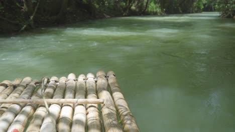 wooden-raft-crossing-cruising-river-inside-jungle-rainforest
