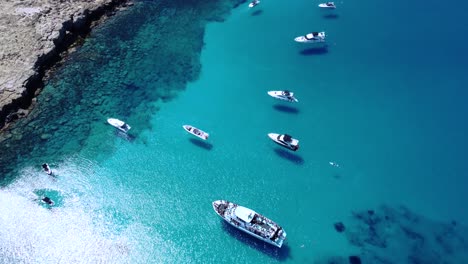 Top-View-over-Yachts-and-Boats-Anchored-on-Cape-Greco,-Ayia-Napa,-Cyprus