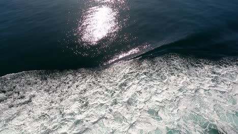 Waves-Coming-Side-Of-Boat,-Dark-Blue-Water-Slow-Motion-Video