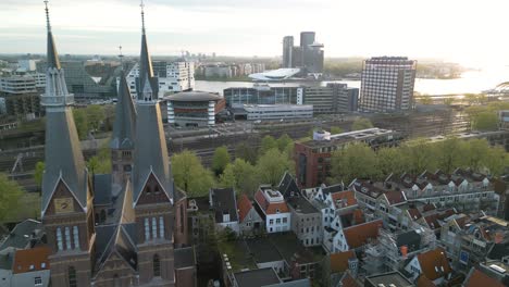 Establishing-Drone-Shot-Over-Downtown-Amsterdam,-Modern-Buildings-in-Background