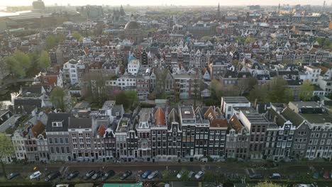 Cinematic-Drone-Shot-Above-Canals-of-Amsterdam,-Historic-Houses