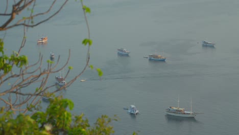 Boats-moored-in-bay,-Padar-island-in-Indonesia