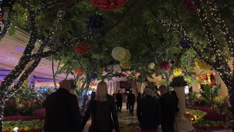 A-couple-walking-through-a-beautiful-indoor-garden-in-a-Las-Vegas-Hotel