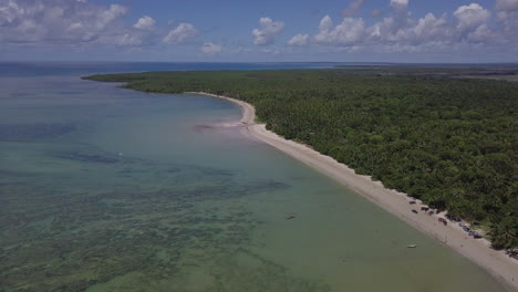 A-captivating-view-unfolds-at-the-Natural-Pools-of-Barra-de-Lagoa-in-Morro-de-Sao-Paulo,-Bahia,-Brazil,-where-lush-green-trees-and-enchanting-white-sands-combine-to-craft-a-serene-ambiance