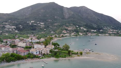Nidri,-an-iconic-seaside-town-and-port-situated-on-Lefkada-island-in-the-Ionian,-Greece,-serves-as-a-gateway-for-travelers-embarking-on-trips-to-the-Ionian-islands-and-surrounding-beaches