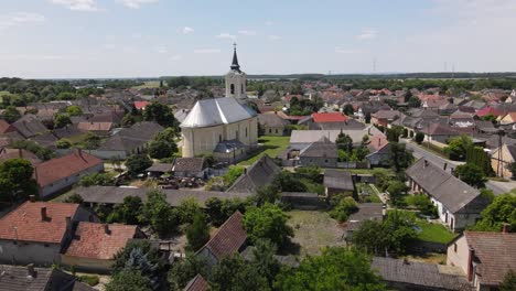 Aerial-view-above-neighborhood,-small-church-in-Batya,-Hungary