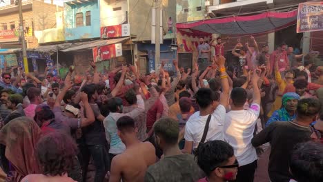 POV-SHOT-In-the-bazaar-big-groups-wearing-different-clothes-are-attracting-people-with-dance-and-colors-and-also-doing-entertainment