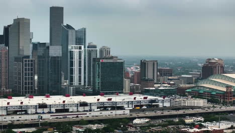 AERIAL:-Houston-skyline-from-the-eastside-side,-foggy-day-in-Texas,-USA---70mm-lens