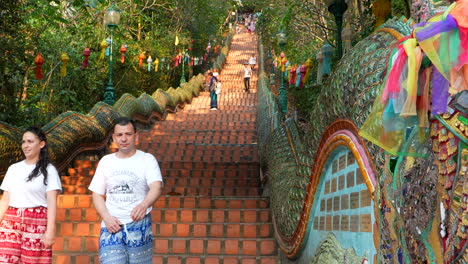 Caucasian-tourists-walking-down-the-stairs-of-Doi-Suthep-temple