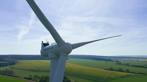 Aerial-view-of-large-wind-turbine-producing-clean-sustainable-energy,-green-energy-revolution