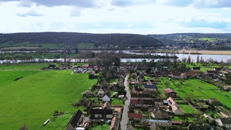 Notre-Dame-de-l'Isle-village-with-river-in-background,-Normandy-in-France