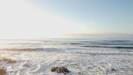 Aerial-Shot-of-the-Waves-of-Pescadero-State-Beach-in-Northern-California