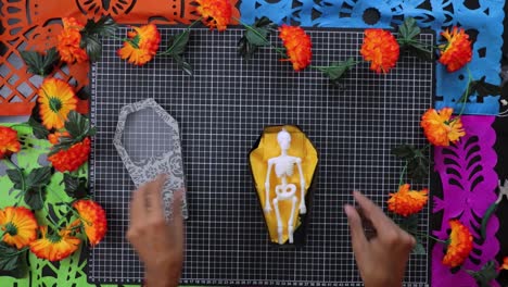 Making-Day-of-the-Dead-decor,-skeleton-and-paper-art-coffin-crafts