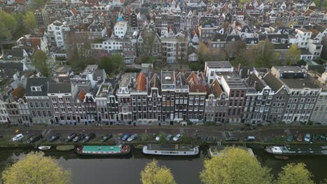 Scenic-Aerial-View-Above-Famous-Canal-Streets-in-Amsterdam-City