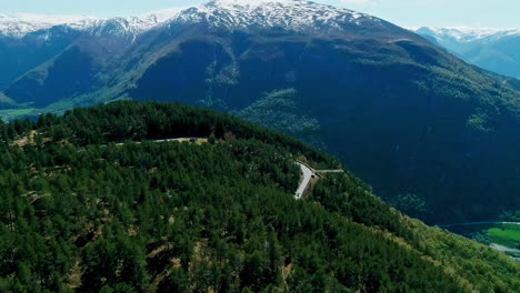 Nature-mountain-covered-snow-hill-road-patch-in-forest-national-park-Road-trip-pine-forest-landscape