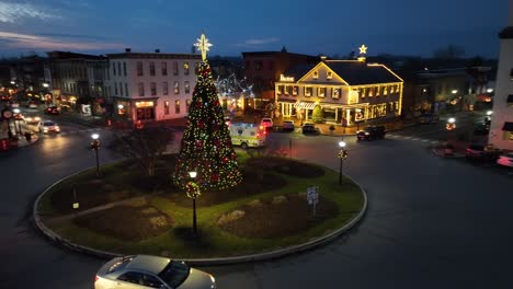 Ambulance-responding-to-medical-emergency-in-picturesque-small-town-decorated-for-Christmas