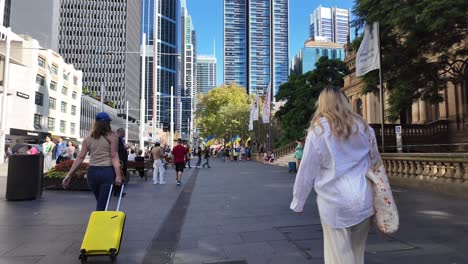 Slow-motion-of-people-walking-near-Town-Hall,-Sydney-CBD