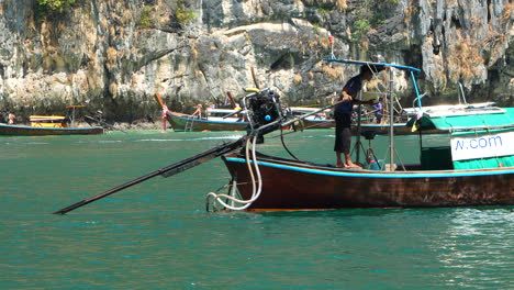 Long-tail-boat-transporting-tourists-in-Phi-Phi-islands,-Slow-motion