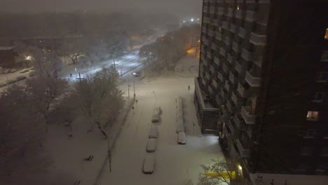Drone-view-of-heavy-snowfall-hitting-the-city-of-Montréal,-Québec,-Canada